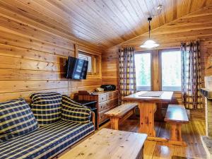 A television and/or entertainment centre at Holiday Home Oloskammi 5 by Interhome