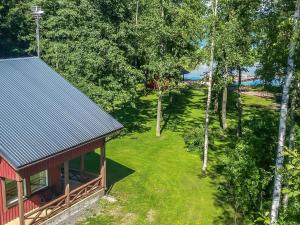 an overhead view of a house with a yard and trees at Holiday Home Långstrands stuga by Interhome in Långstrand
