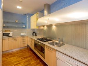 a kitchen with a sink and a stove top oven at Apartment Plaza Catalunya-Rda-Universidad by Interhome in Barcelona +12 photos