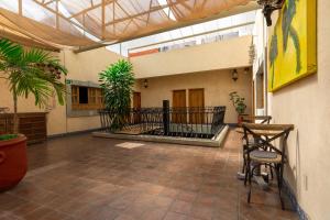 an empty courtyard with plants in a building at Casa Magica in Guanajuato
