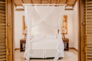 Ένα ή περισσότερα κρεβάτια σε δωμάτιο στο Casa Pitanga - Caraíva