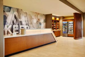 a lobby of a store with a cash register at SpringHill Suites by Marriott Springfield North in Springfield