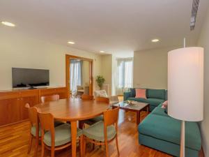 a living room with a table and a couch at Apartment Plaza Catalunya-Rda-Universidad by Interhome in Barcelona