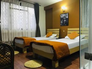 Postel nebo postele na pokoji v ubytování The Majestic Bed & Breakfast