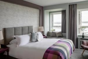 Postel nebo postele na pokoji v ubytování Armada Hotel