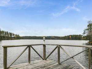 a dock with a view of a lake at Holiday Home Rinteelä by Interhome in Heinävesi