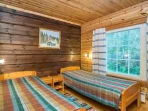 Katil atau katil-katil dalam bilik di Holiday Home Lassinmaja by Interhome