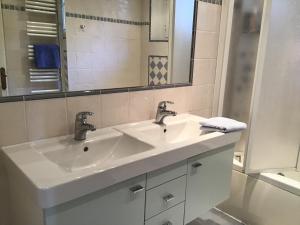 a white bathroom with a sink and a mirror at Luxurious sea view villa in Saint Paul de Vence in Saint-Paul-de-Vence +23 photos