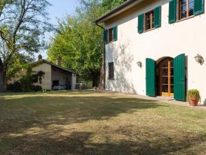 an exterior view of a house with a yard at Holiday Home Villa San Gervasio by Interhome in Castiglione del Bosco