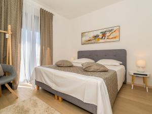Postel nebo postele na pokoji v ubytování Holiday Home Villa Meri 2 by Interhome