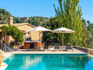 The swimming pool at or close to Villa Santa Llucia by Interhome