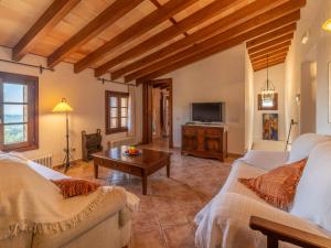 A television and/or entertainment centre at Villa Santa Llucia by Interhome