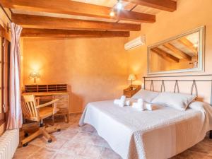 A bed or beds in a room at Villa Santa Llucia by Interhome