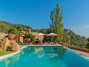 The swimming pool at or close to Villa Santa Llucia by Interhome