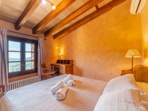 A bed or beds in a room at Villa Santa Llucia by Interhome