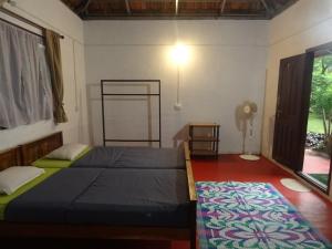 מיטה או מיטות בחדר ב-Tranquilandia
