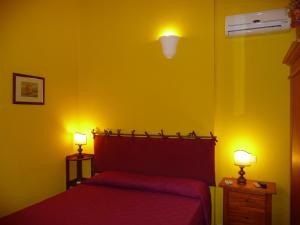 Postel nebo postele na pokoji v ubytování Aldebaran Centro Storico