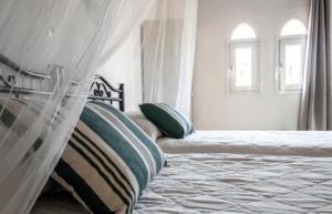 A bed or beds in a room at Stavros Villas&Apartments