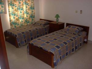 Uma cama ou camas num quarto em Residencial Pôr do Sol