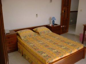 Uma cama ou camas num quarto em Residencial Pôr do Sol
