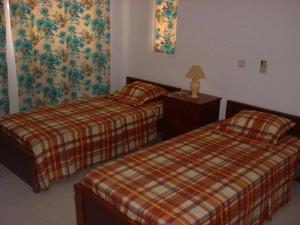 Uma cama ou camas num quarto em Residencial Pôr do Sol