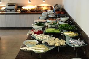 a buffet line with many different types of food at Erzurumlu Hotel in Kilyos