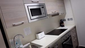 Kuchyňa alebo kuchynka v ubytovaní Apartamentos Real Lleida