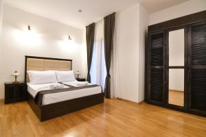 Postel nebo postele na pokoji v ubytování Boutique Hotel Kredo