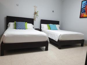 A bed or beds in a room at Casa XunanKab