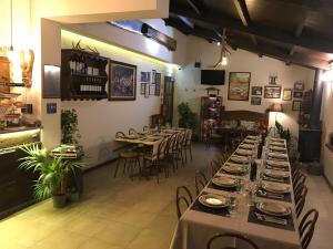 a dining room with tables and chairs in a restaurant at Micro Cabana Rotativa in Bragança