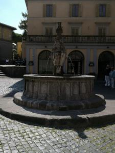 a water fountain in front of a building at Il Viterbino Struttura convenzionata con impianti termali in Viterbo