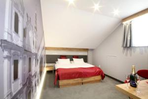 Posteľ alebo postele v izbe v ubytovaní Hotel Strážnice