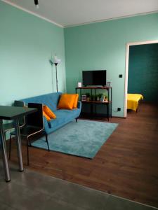 Televízia a/alebo spoločenská miestnosť v ubytovaní Apartament Santo Bartolomeo
