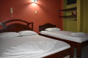 A bed or beds in a room at LA POSADA DEL VIAJERO