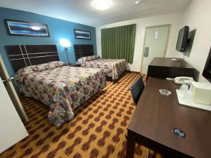 Lodge Inn Wrightstown - Fort Dix客房内的一张或多张床位