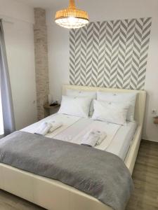 A bed or beds in a room at M Apartments, Kallikratia