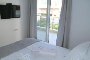 A bed or beds in a room at M Apartments, Kallikratia