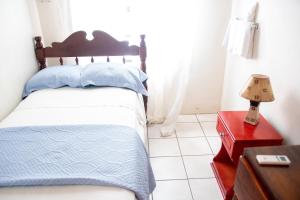 Кровать или кровати в номере Tropical Breeze Vacation Home and Apartments