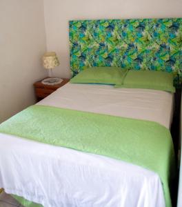 Кровать или кровати в номере Tropical Breeze Vacation Home and Apartments