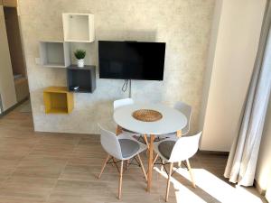 A television and/or entertainment centre at Apartments M, Kallikratia