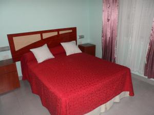 Una cama o camas en una habitación de FERNANDEZ TOMAS