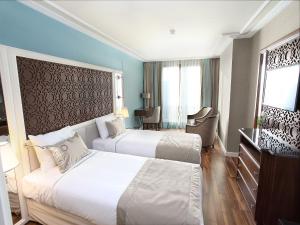 Lova arba lovos apgyvendinimo įstaigoje Grand Durmaz Hotel