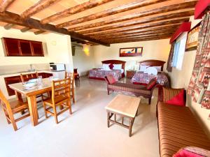 a living room with a couch and a table at Hotel El Campanario Playa del Carmen in Playa del Carmen