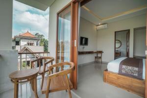TV a/nebo společenská místnost v ubytování Putih DCarik Ubud
