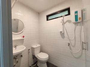 a bathroom with a shower and a toilet and a sink at No.17 @ Khaoyai in Mu Si