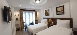 Krevet ili kreveti u jedinici u okviru objekta Hanoi Endless Hotel