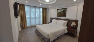 Postel nebo postele na pokoji v ubytování Hanoi Endless Hotel