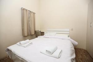 Postel nebo postele na pokoji v ubytování Hotel Rustaveli 36