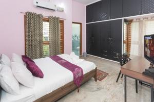 Letto o letti in una camera di LikeMyHome Homestay Mysore