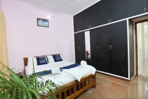 Letto o letti in una camera di LikeMyHome Homestay Mysore